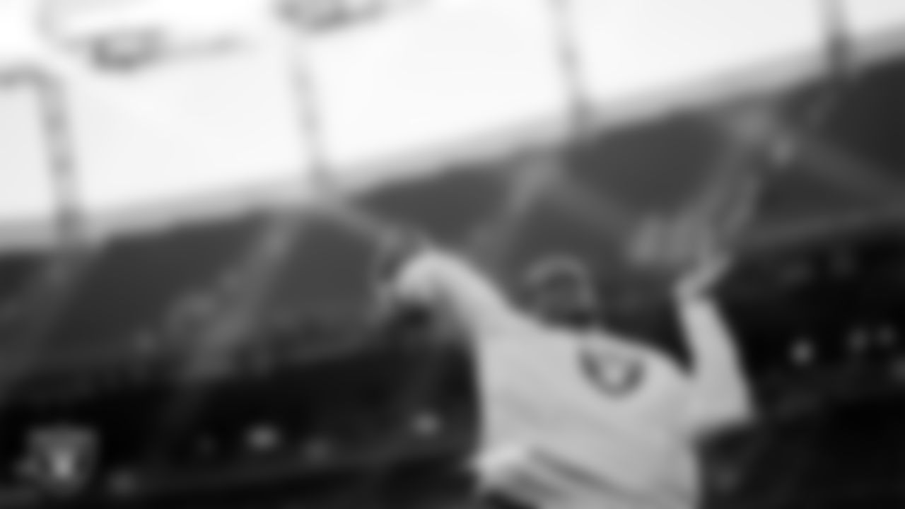 Las Vegas Raiders quarterback Geno Smith (7) warming up before the regular season away game against the Denver Broncos at Empower Field at Mile High.