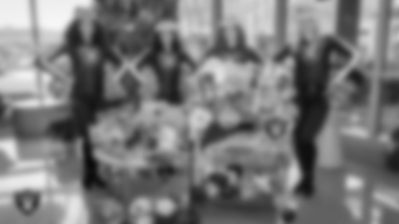 Raiderettes Shayla, Sloane, Lexie and Kennedy pose for a photo during a toy drive at Intermountain Health Primary Children's Hospital.