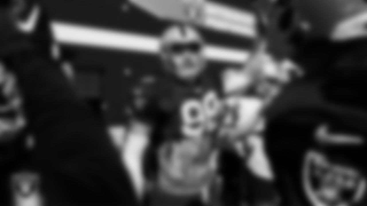 Las Vegas Raiders defensive end Maxx Crosby (98) in a huddle during practice at Intermountain Health Performance Center.