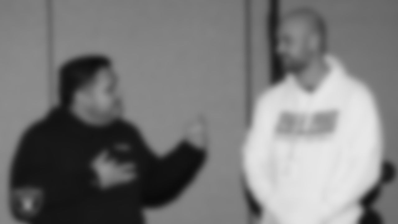 Las Vegas Raiders senior manager of football development Jordan Aguilar speaks to Spanish Springs High School football coach and Tom Flores High School Coach of the Year Rob Hummel during a Glazier Clinic at Grand Sierra Resort.