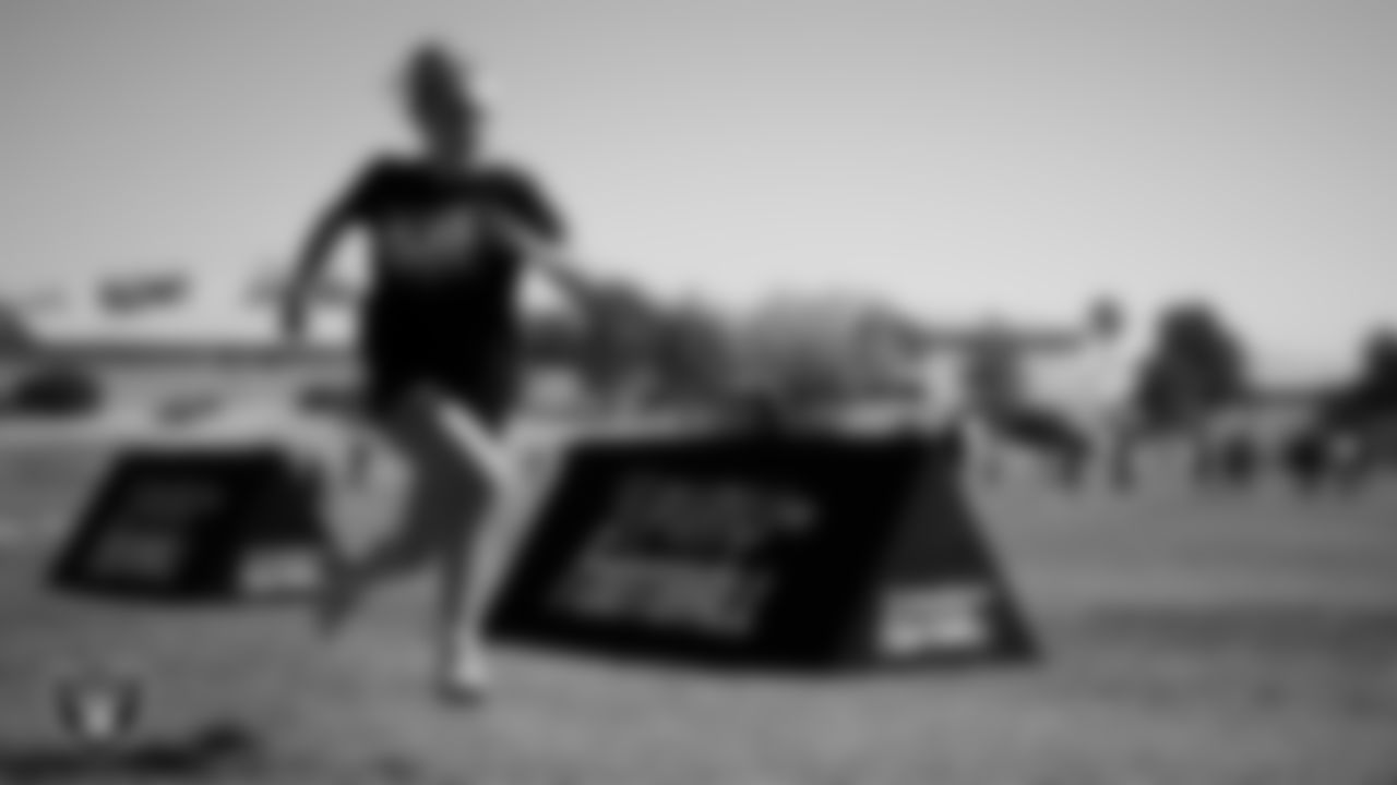 An athlete takes part in a drill after a partnership announcement between the Las Vegas Raiders and Clark County School District as a Silver and Black Flag Football league at the middle school level at Sig Rogich Middle School.