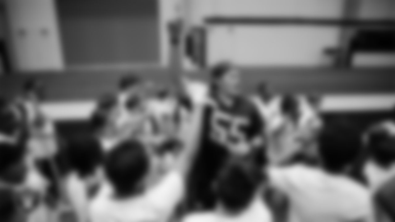 Las Vegas Raiders linebacker Cody Lindenberg (55) huddles with athletes at a skills camp during Play Football Day at Intermountain Health Performance Center.