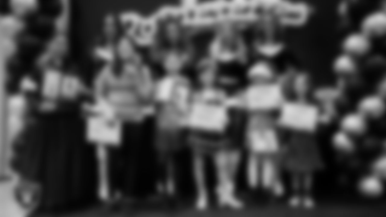 Raiderettes pose for a photo with Junior Raiderettes during the Junior Raiderettes Banquet at The Studio.