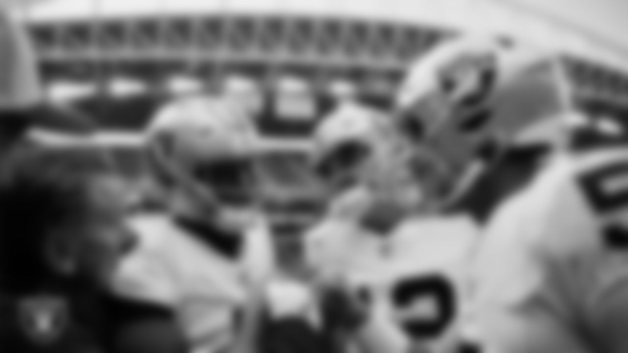 The Las Vegas Raiders quarterbacks huddle before the preseason away game against the Seattle Seahawks at Lumen Field.