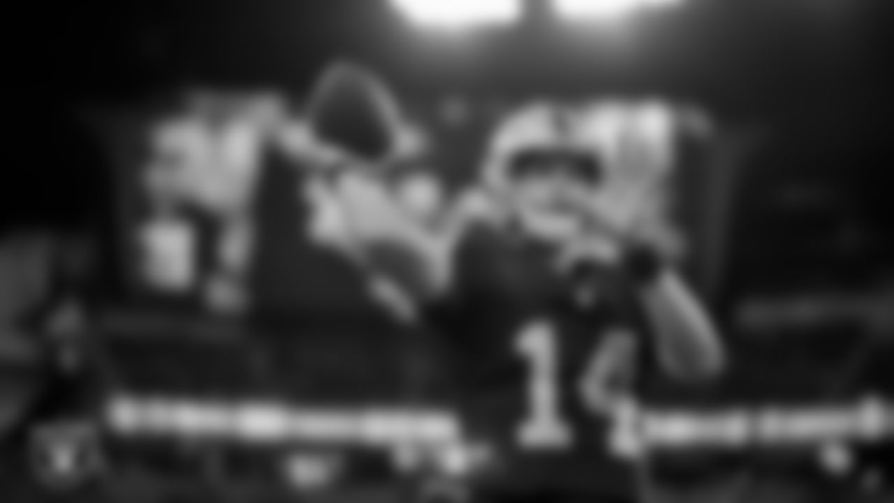 Las Vegas Raiders quarterback Carter Bradley (14) warming up before the preseason home game against the San Francisco 49ers at Allegiant Stadium.