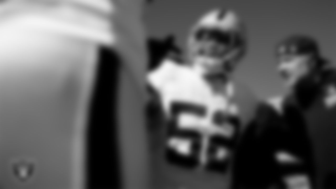 Las Vegas Raiders linebacker Elandon Roberts (52) in a huddle before the regular season away game against the Kansas City Chiefs at GEHA Field at Arrowhead Stadium.