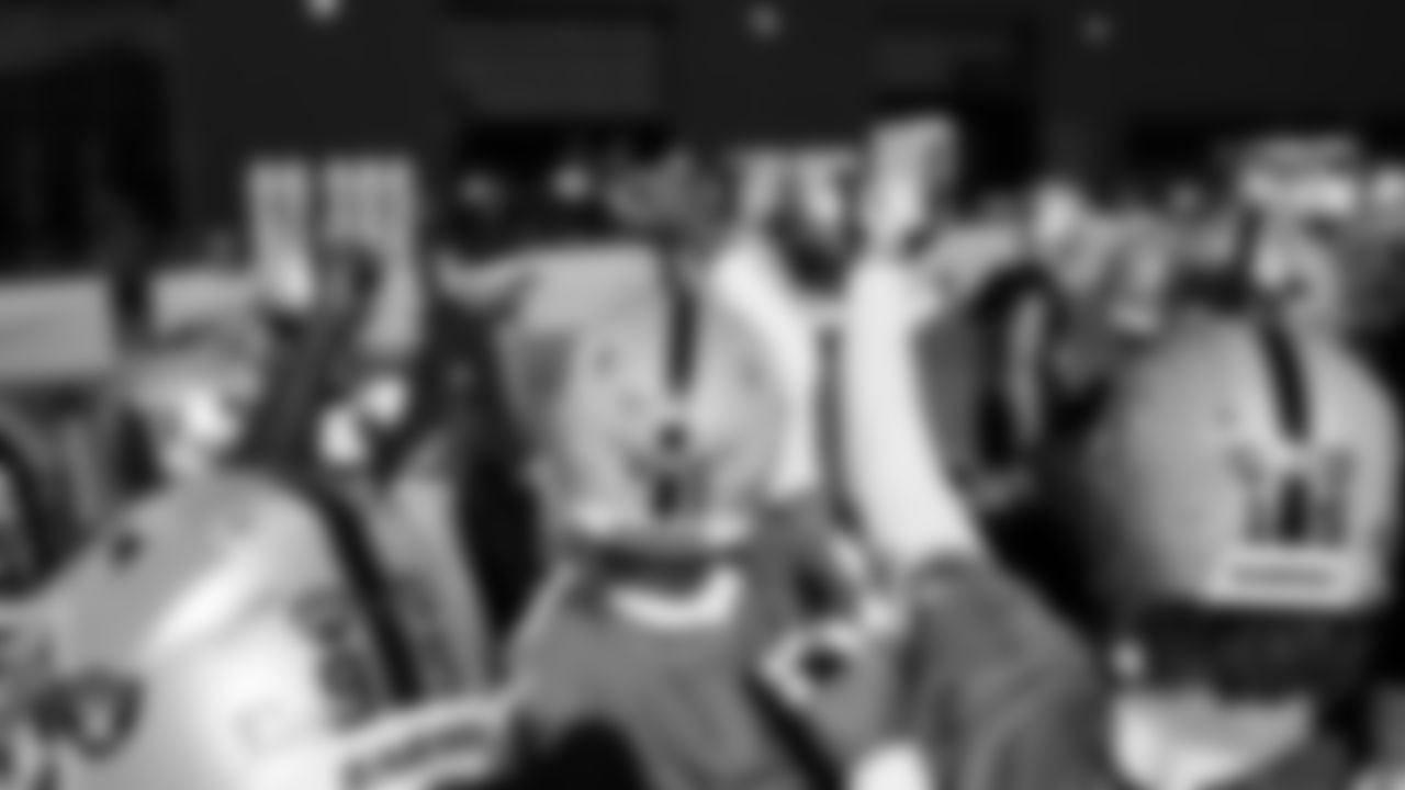 The Las Vegas Raiders huddle during practice at Intermountain Health Performance Center.