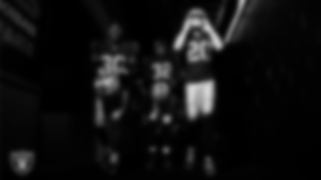 Las Vegas Raiders cornerback Darnay Holmes (30), safety Lonnie Johnson Jr. (32) and safety Isaiah Pola-Mao (20) walk down the tunnel before the regular season home game against the Kansas City Chiefs at Allegiant Stadium.