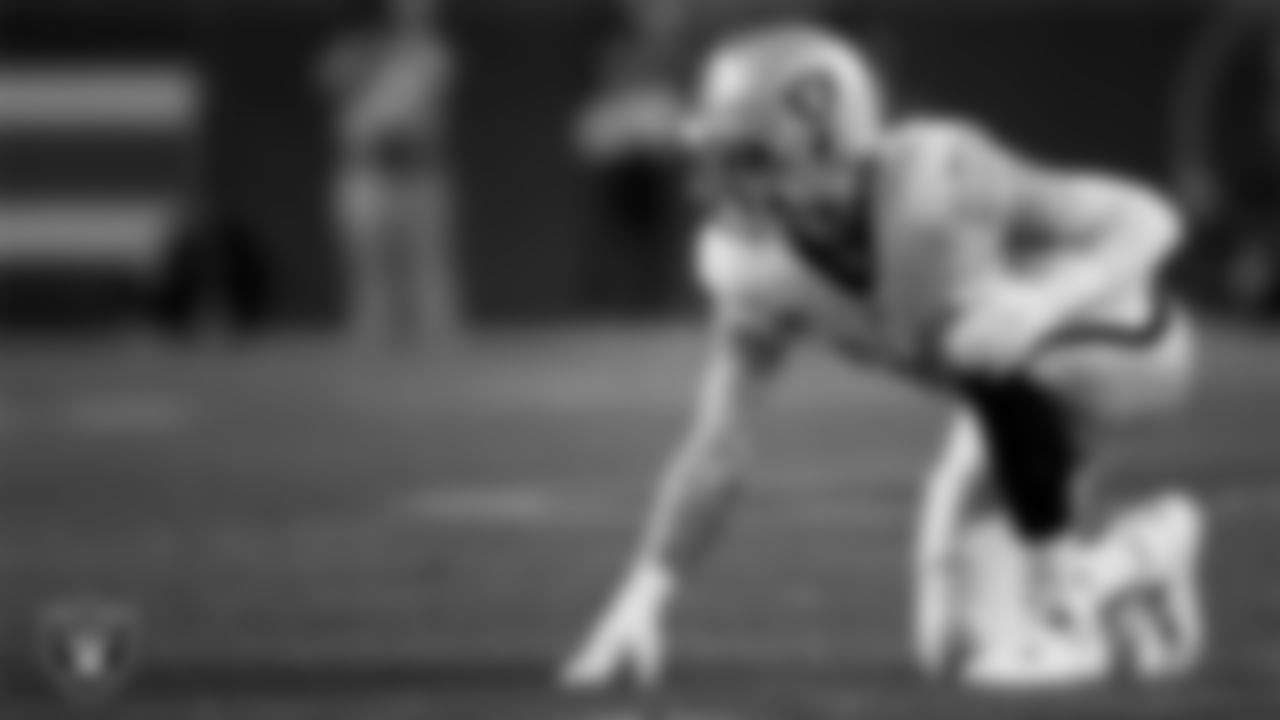 Las Vegas Raiders defensive end Maxx Crosby (98) lines up before the snap during the regular season away game against the Denver Broncos at Empower Field at Mile High.