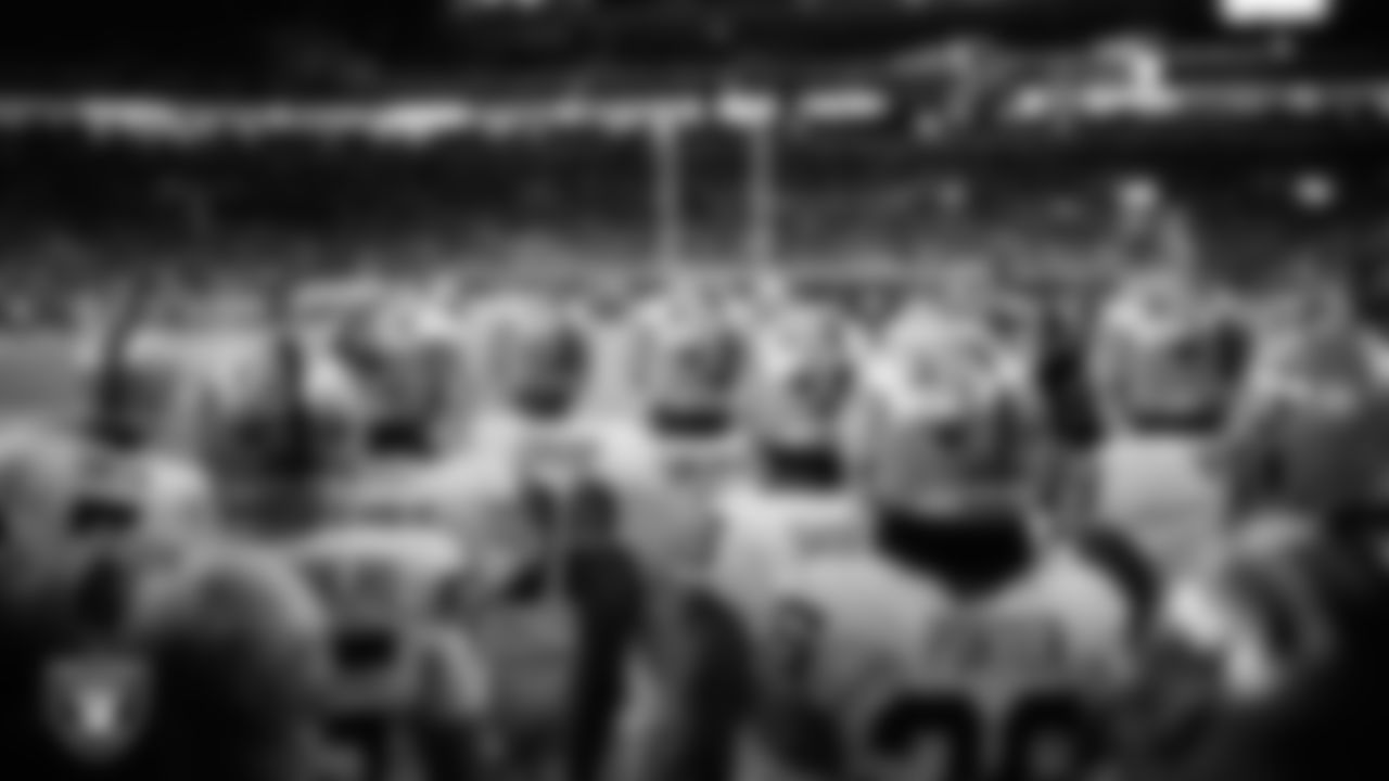 The Las Vegas Raiders wait to be introduced onto the field before the regular season away game against the Indianapolis Colts at Lucas Oil Stadium.