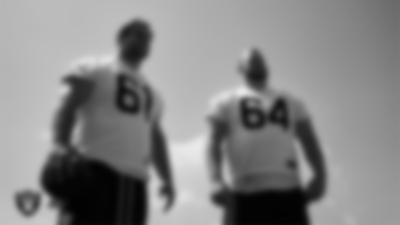 Las Vegas Raiders offensive lineman Jordan Meredith (61) and center Jarrod Hufford (64) at an Organized Team Activity (OTA) at Intermountain Health Performance Center.