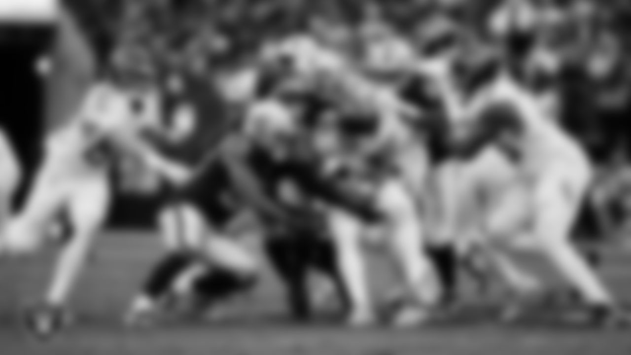 Las Vegas Raiders defensive end Tyree Wilson (9) makes a tackle during the regular season home game against the Tennessee Titans at Allegiant Stadium.