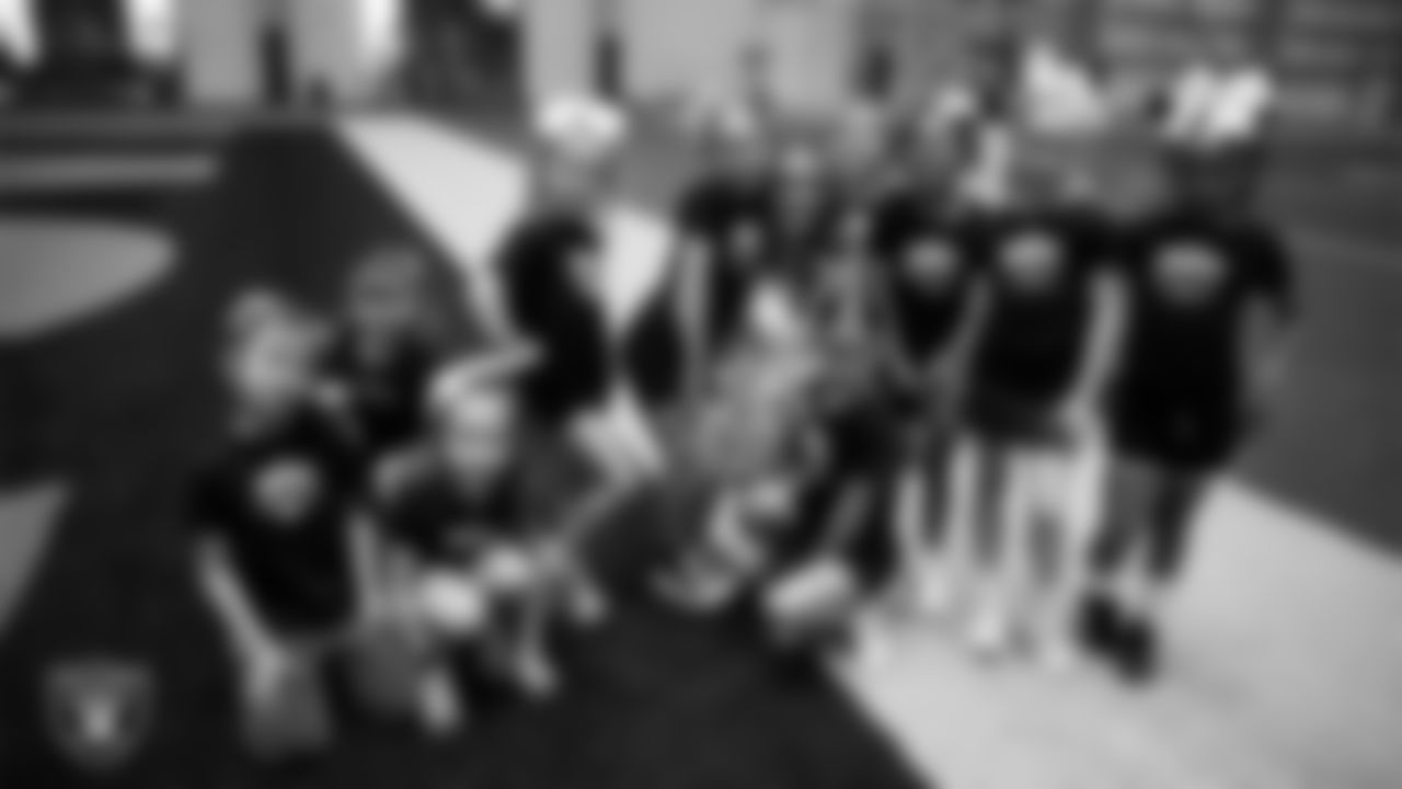 Raiderette Shelby poses with dancers during day three of summer camp at Intermountain Health Performance Center.