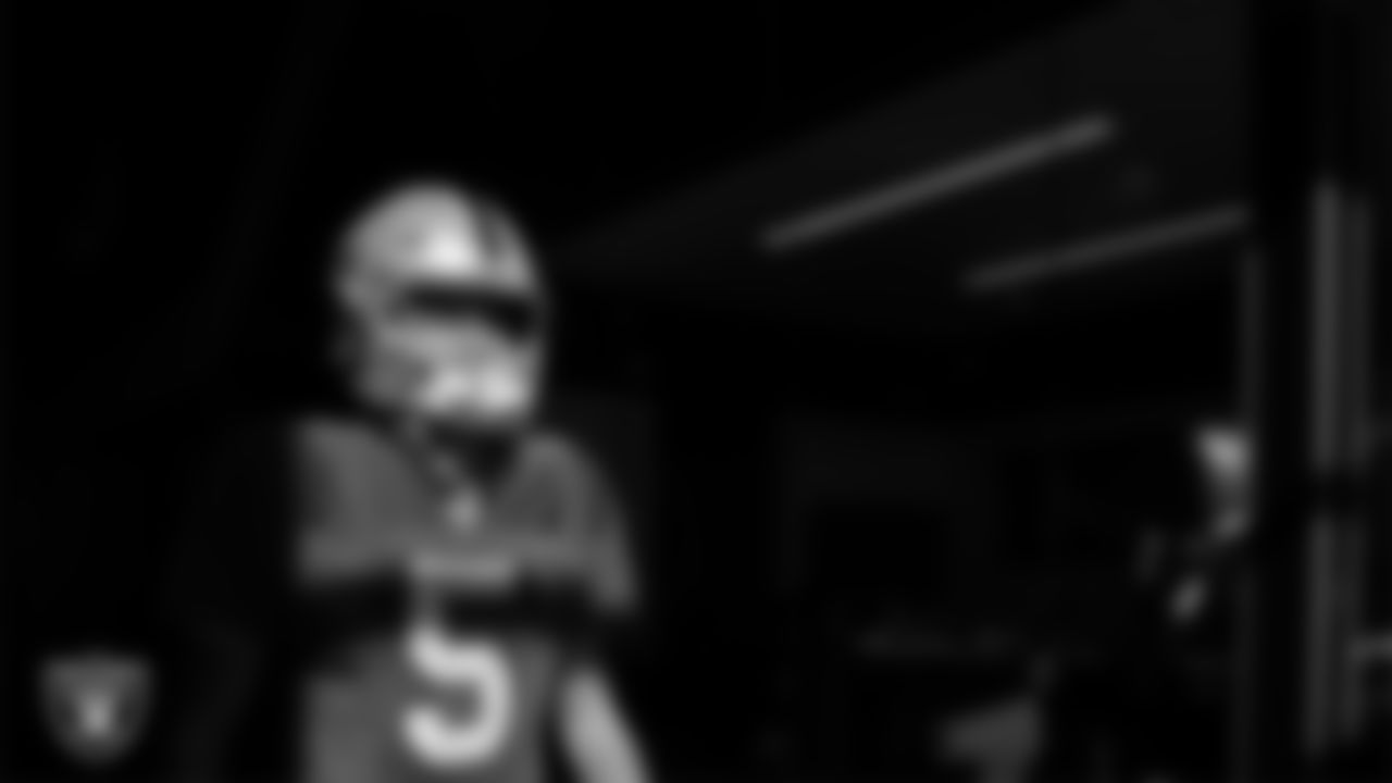 Las Vegas Raiders quarterback Cam Miller (5) walks out to the field for practice at Intermountain Health Performance Center.