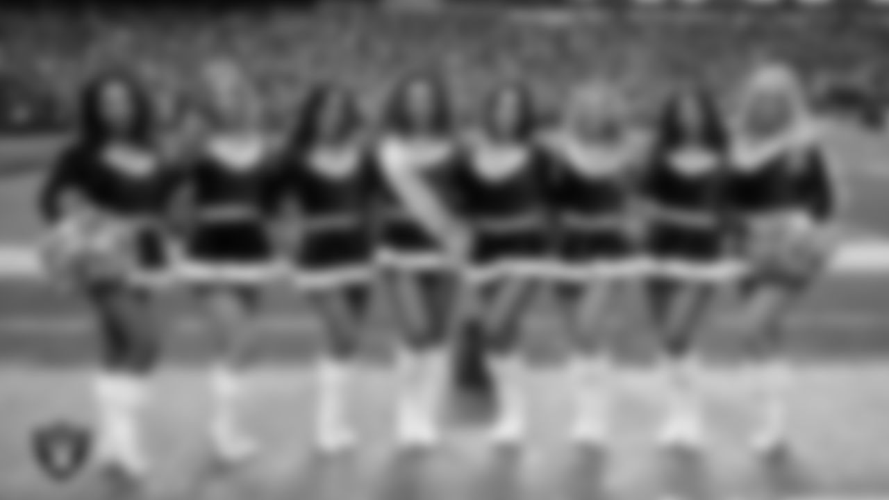 Line 1 of the Raiderettes poses for a photo on the sidelines during the regular season home game against the New York Giants at Allegiant Stadium.