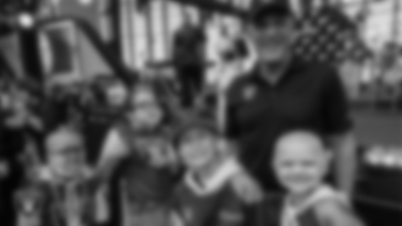 Intermountain Health CEO Rob Allen with Intermountain Children's Health patients during a ceremony before the Las Vegas Raiders' regular season home game against the Tennessee Titans at Allegiant Stadium.