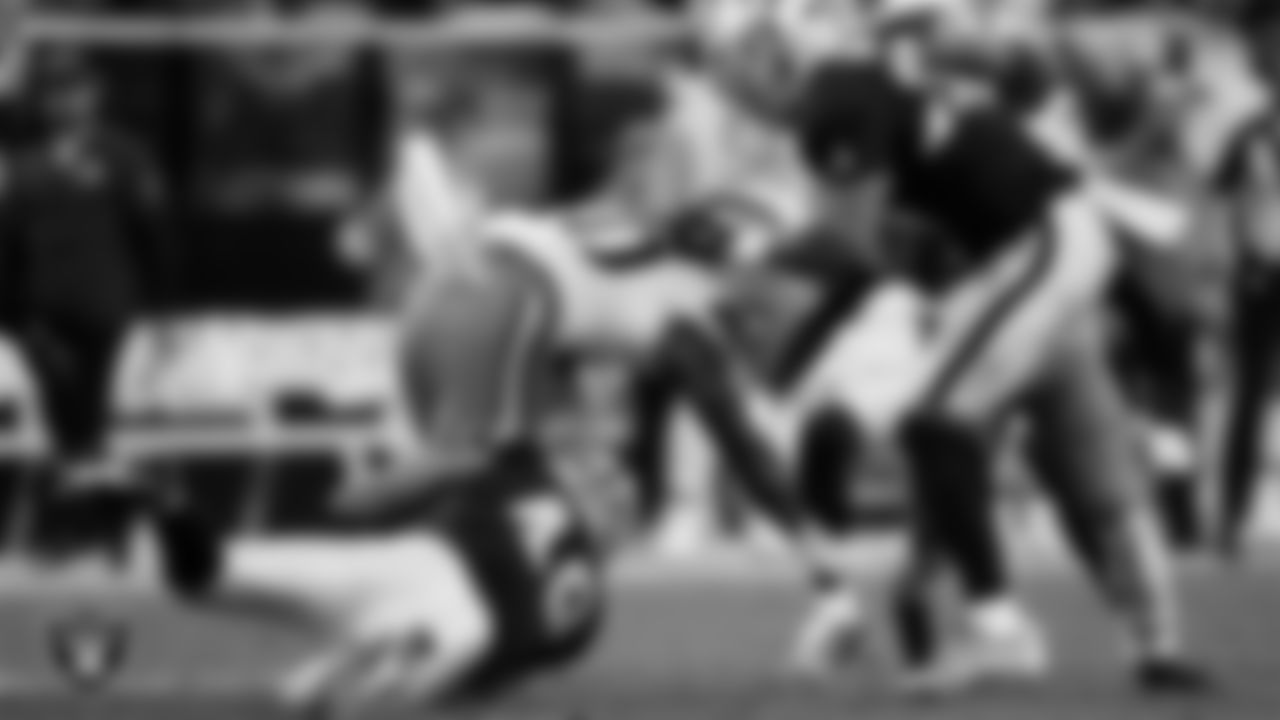 Las Vegas Raiders defensive end Charles Snowden (49) makes a tackle during the regular season home game against the Cleveland Browns at Allegiant Stadium.