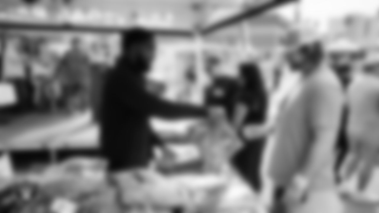 Attendees grab Las Vegas Raiders gear during the Veterans Tailgate in Downtown Las Vegas.