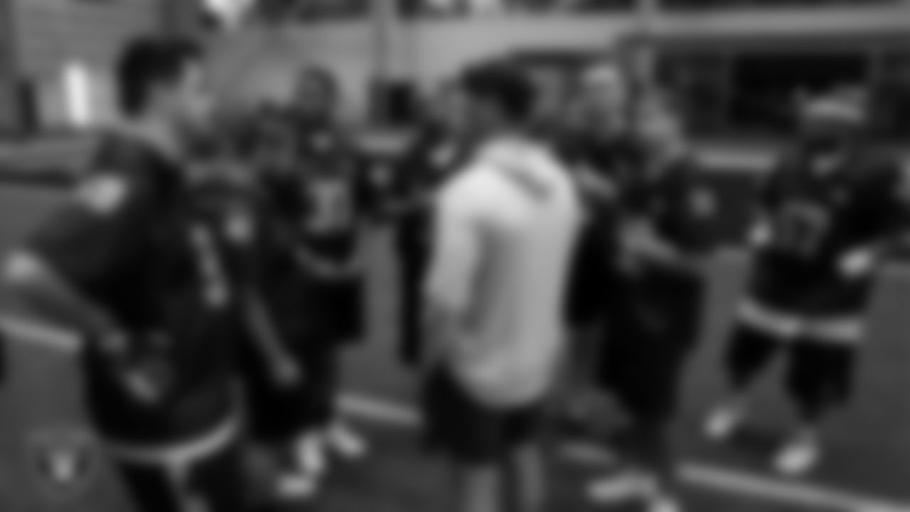 Special Olympics of Nevada, Las Vegas athletes huddle with their coach during the flag football regional tournament at Intermountain Health Performance Center.