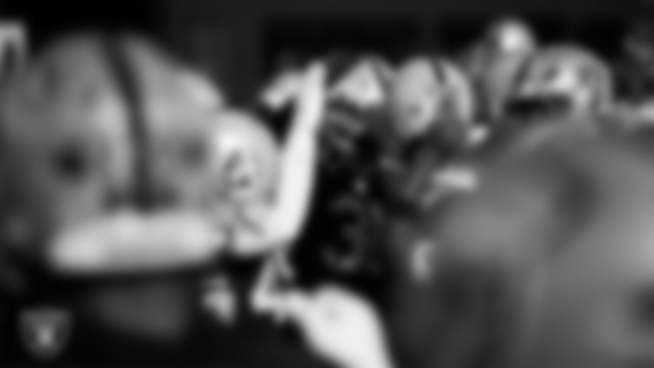 The Las Vegas Raiders huddle during practice at Intermountain Health Performance Center.