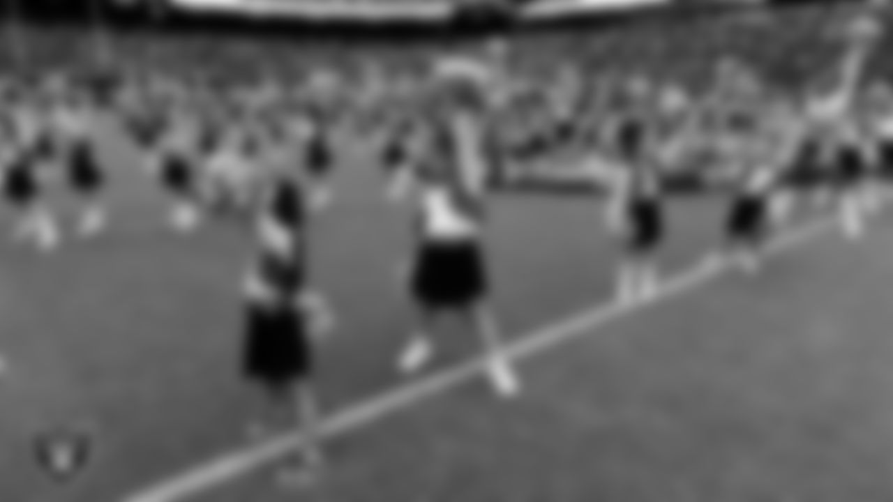 The Raiderettes and Junior Raiderettes perform on the field before the preseason home game against the San Francisco 49ers at Allegiant Stadium.