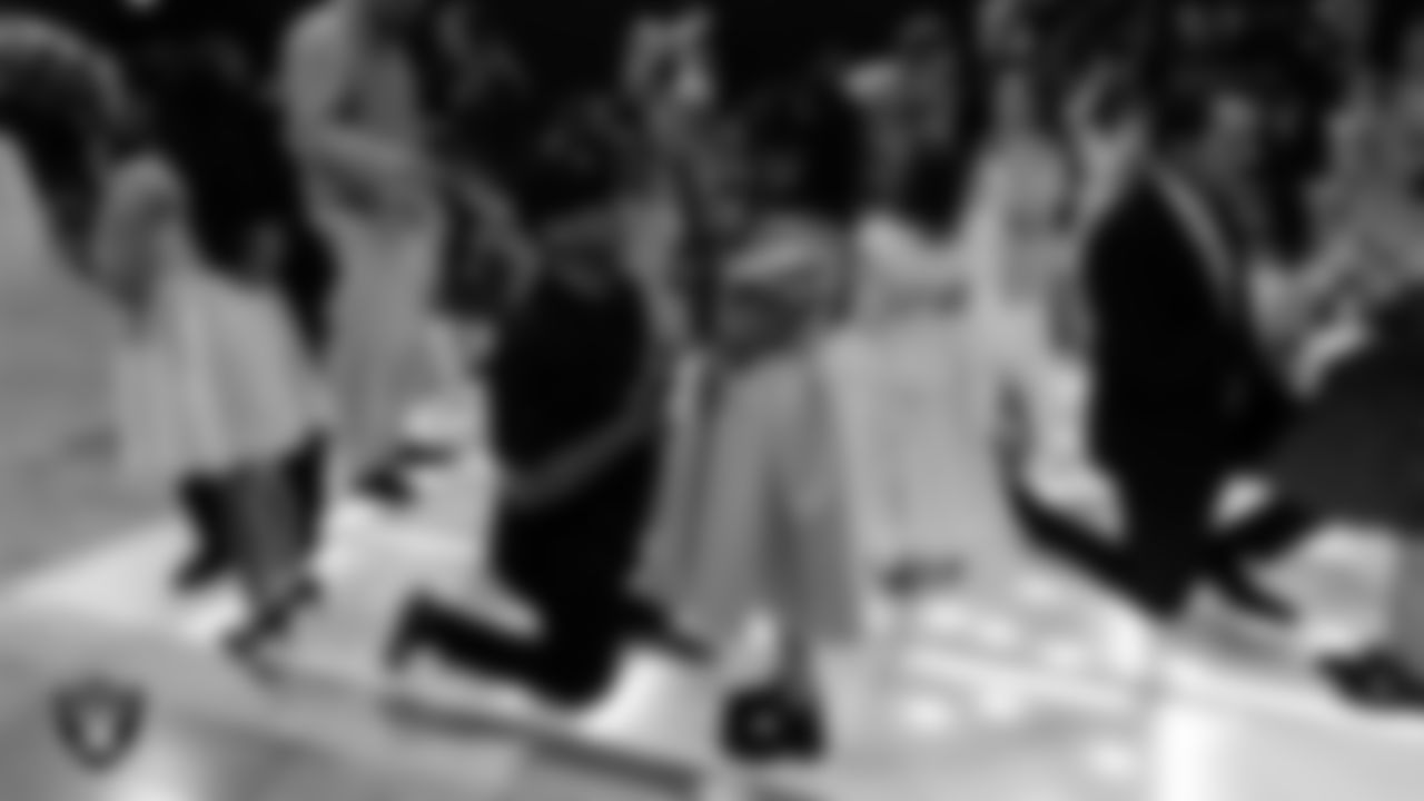 Attendees exchange roses during the Valentine's Day Dance at The Studio.