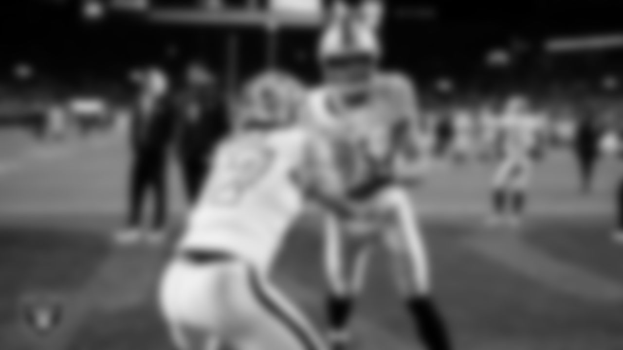 Las Vegas Raiders tight end Michael Mayer (87) and tight end Brock Bowers (89) warming up before the regular season away game against the Denver Broncos at Empower Field at Mile High.