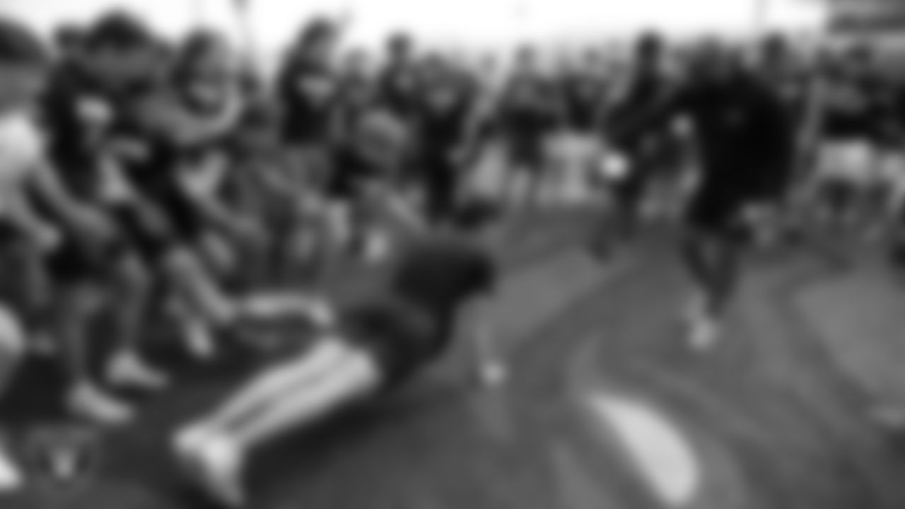 Athletes compete in the Strongest Man challenge during a Las Vegas Raiders 11-ON event at Damonte Ranch High School.