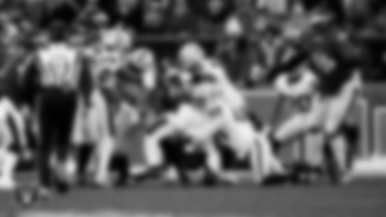 Las Vegas Raiders defensive end Charles Snowden (49) and defensive tackle Adam Butler (69) make a tackle during the regular season away game against the Philadelphia Eagles at Lincoln Financial Field.