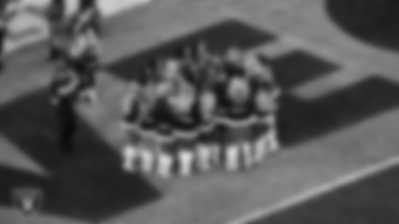 Raiderette Lexie celebrates with teammates after being named Raiderette of the Year during the regular season home game against the New York Giants at Allegiant Stadium.