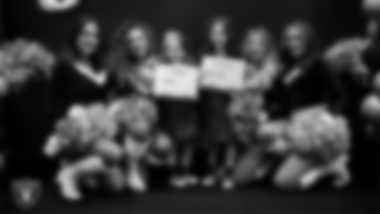 Raiderettes pose for a photo with Junior Raiderettes during the Junior Raiderettes Banquet at The Studio.