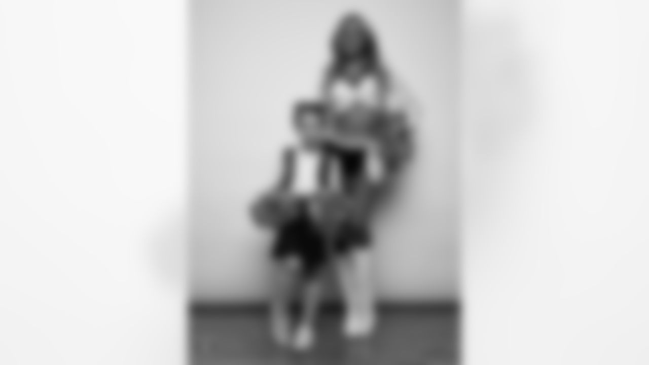 Raiderette Hayley poses for a photo with a Junior Raiderette during 2025 Media Day at The Studio.