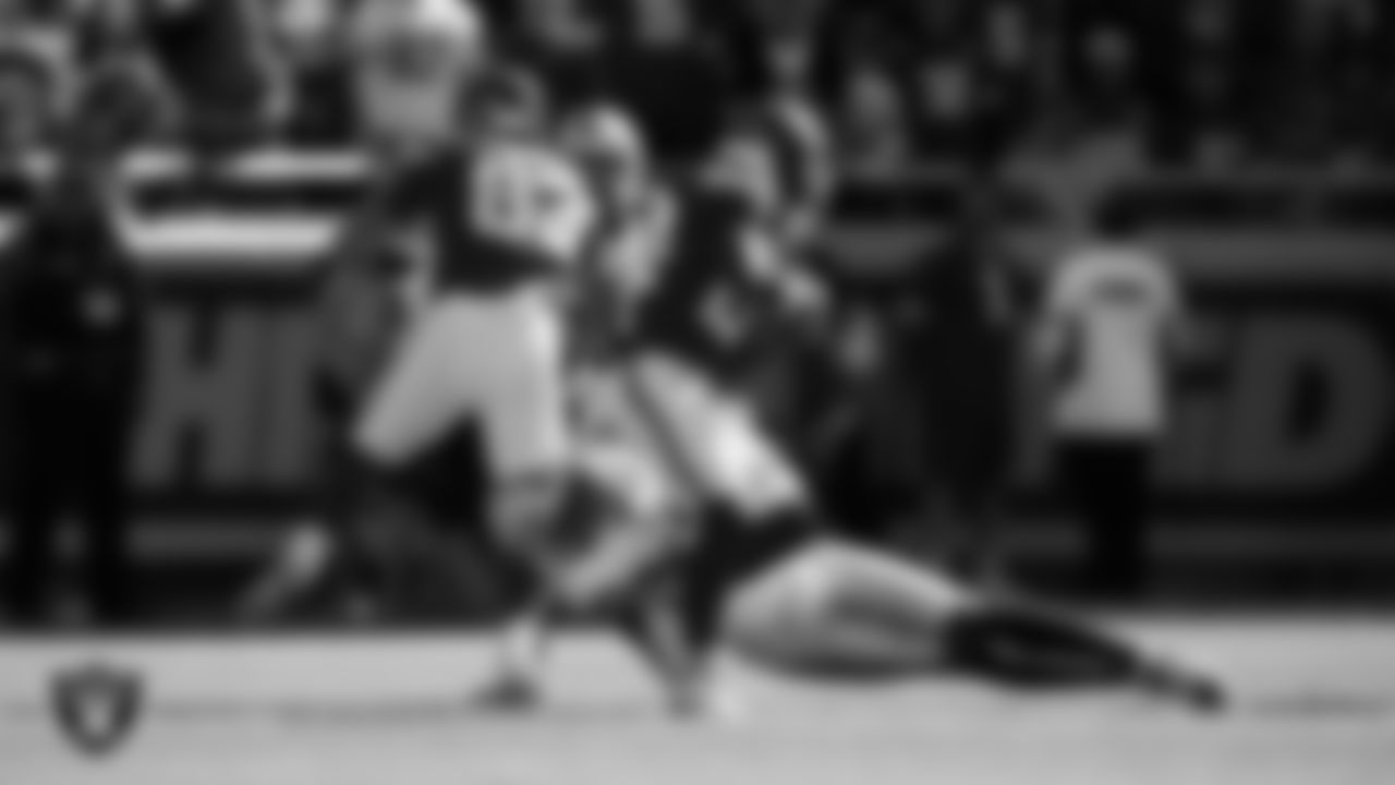 Las Vegas Raiders safety Isaiah Pola-Mao (20) makes a tackle during the regular season away game against the Kansas City Chiefs at GEHA Field at Arrowhead Stadium.