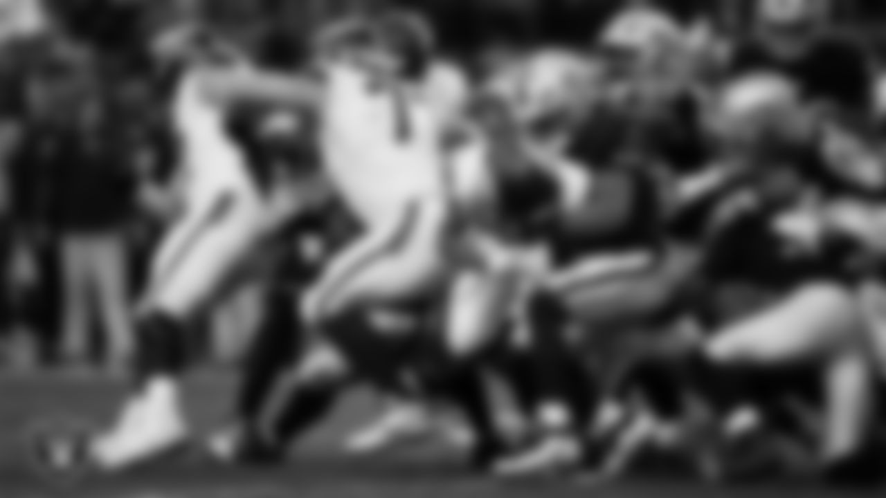 Las Vegas Raiders safety Jeremy Chinn (11) makes a tackle during the regular season home game against the Denver Broncos at Allegiant Stadium.