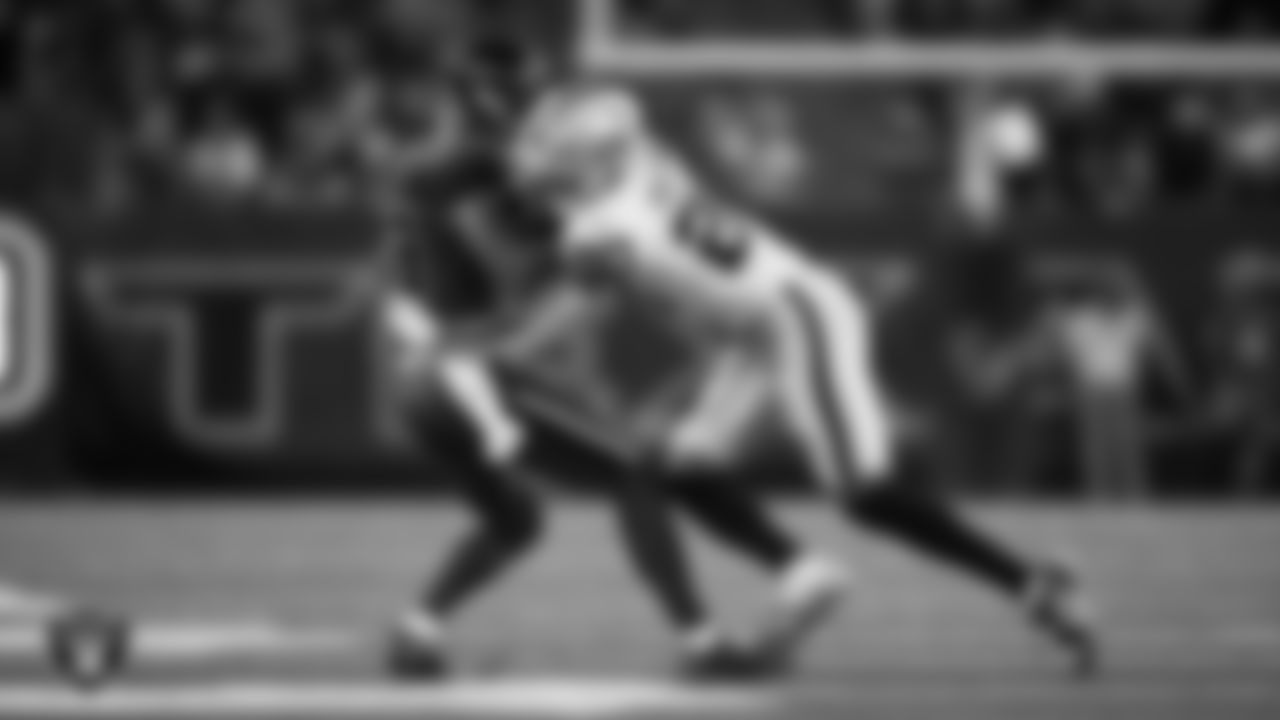 Las Vegas Raiders safety Isaiah Pola-Mao (20) makes a tackle during the regular season away game against the Houston Texans at NRG Stadium.