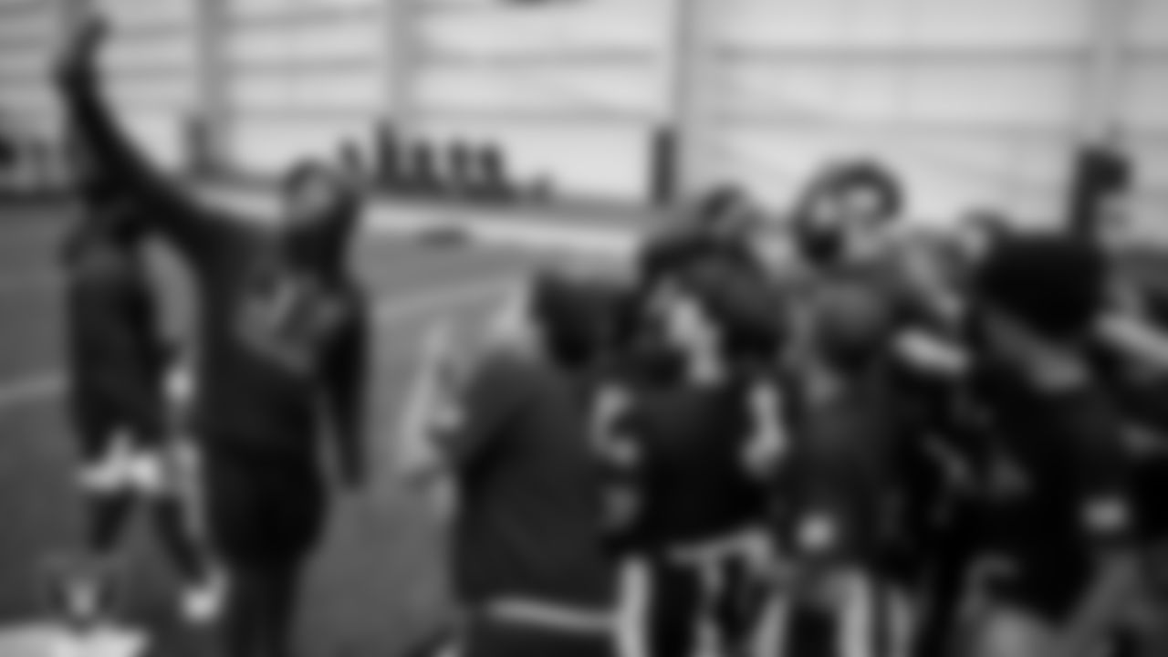 A member of the Jackson State University football team records at they break a huddle during a Raiders Junior Training Camp at Intermountain Health Performance Center.
