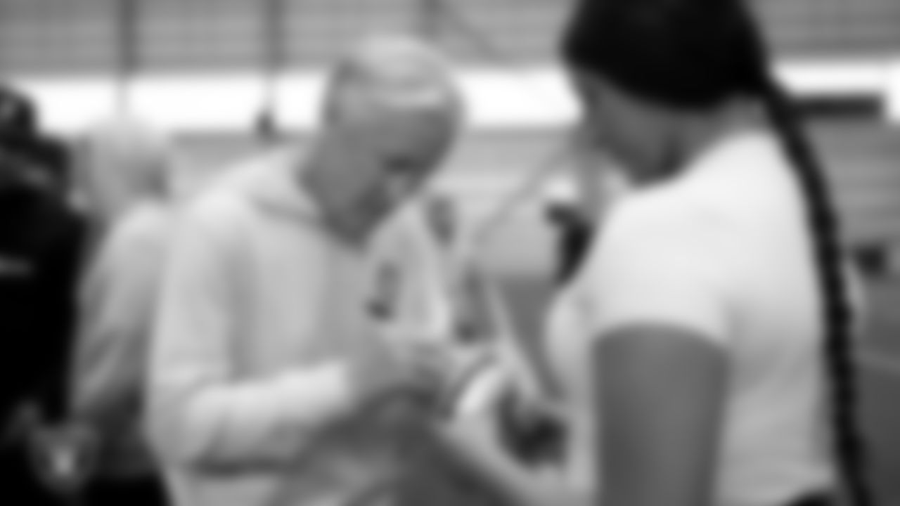 Las Vegas Raiders Head Coach Pete Carroll signs an autograph during a walkthrough at Intermountain Health Performance Center.