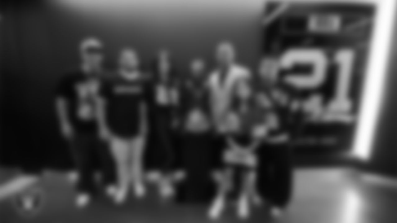 Las Vegas Raiders alumnus Eric Allen poses for a photo with his family after his Hall of Fame plaque unveiling before the Raiders' regular season home game against the Tennessee Titans at Allegiant Stadium.