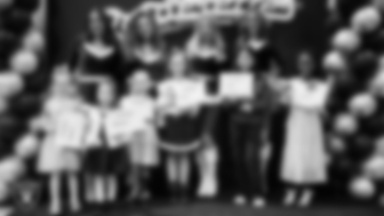 Raiderettes pose for a photo with Junior Raiderettes during the Junior Raiderettes Banquet at The Studio.