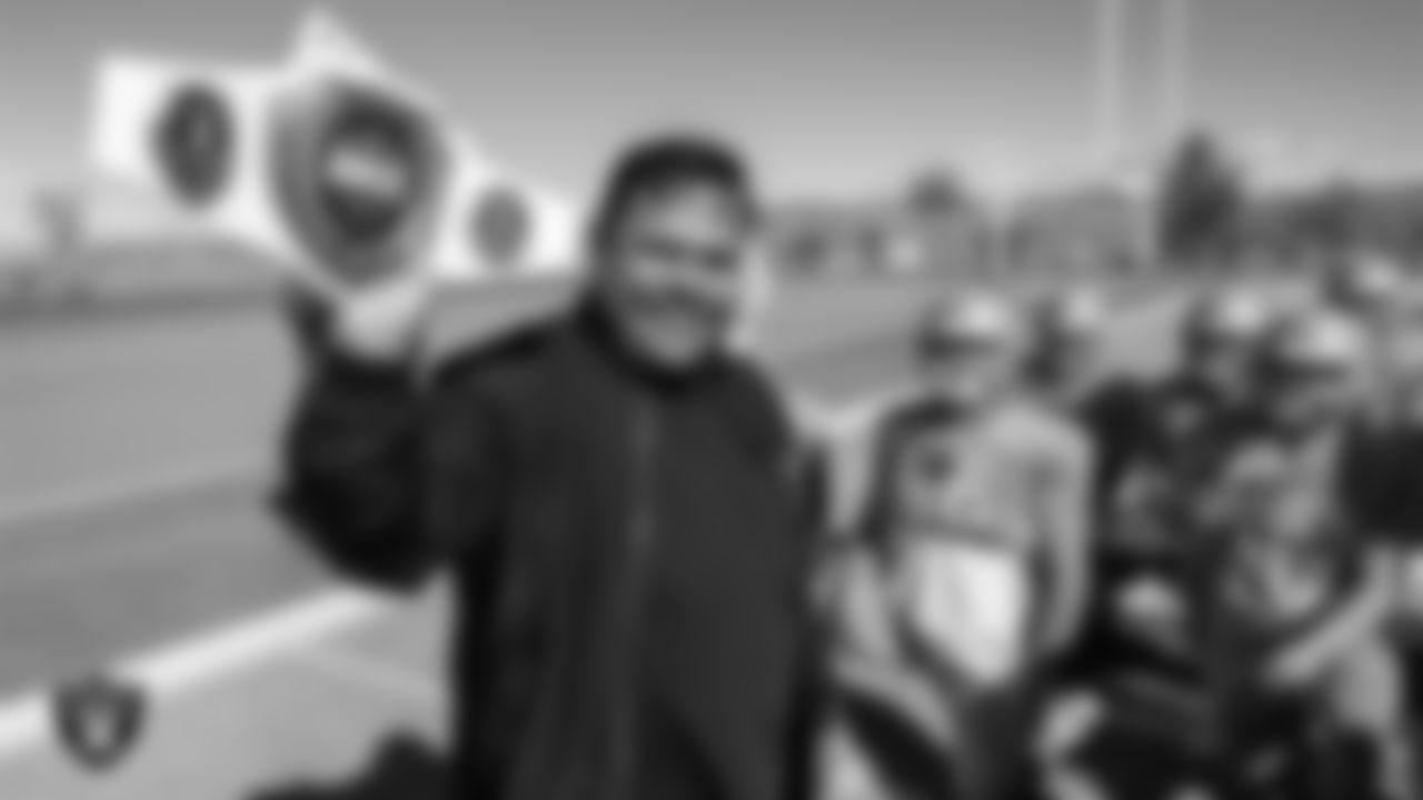 Las Vegas Raiders senior manager of football development Jordan Aguilar shows off the championship belt to the Foothill High School football team during practice at Foothill High School.