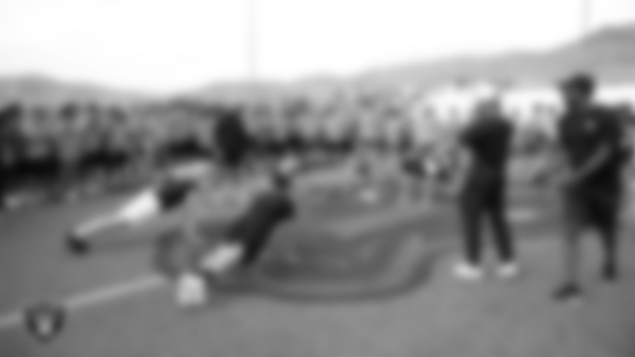 Athletes compete in the Strongest Man challenge during a Las Vegas Raiders 11-ON event at Damonte Ranch High School.