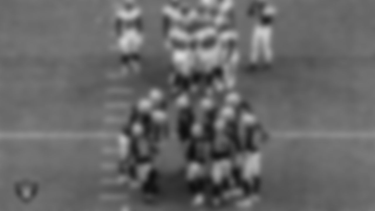 Las Vegas Raiders quarterback Derek Carr (4) calls a play in the huddle during the regular season home game against the Tampa Bay Buccaneers at Allegiant Stadium, Sunday, October 25, 2020, in Las Vegas, Nev.