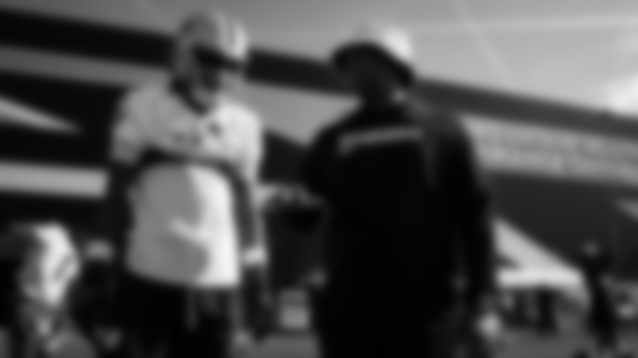 Las Vegas Raiders wide receiver Dont'e Thornton Jr. (10) and wide receivers coach Chris Beatty on the field for practice at 2025 Training Camp at Intermountain Health Performance Center.