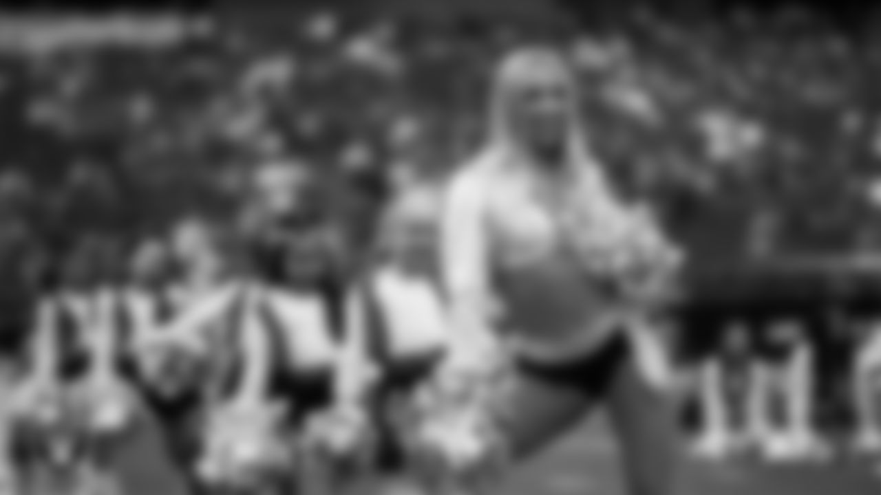 Raiderette Delaney and Junior Raiderettes perform on the field before the preseason home game against the San Francisco 49ers at Allegiant Stadium.