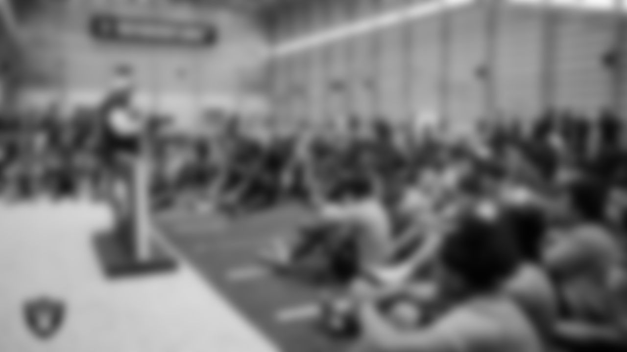 Las Vegas Raiders senior manager of football development Jordan Aguilar speaks to athletes during the 11-ON at Intermountain Health Performance Center
