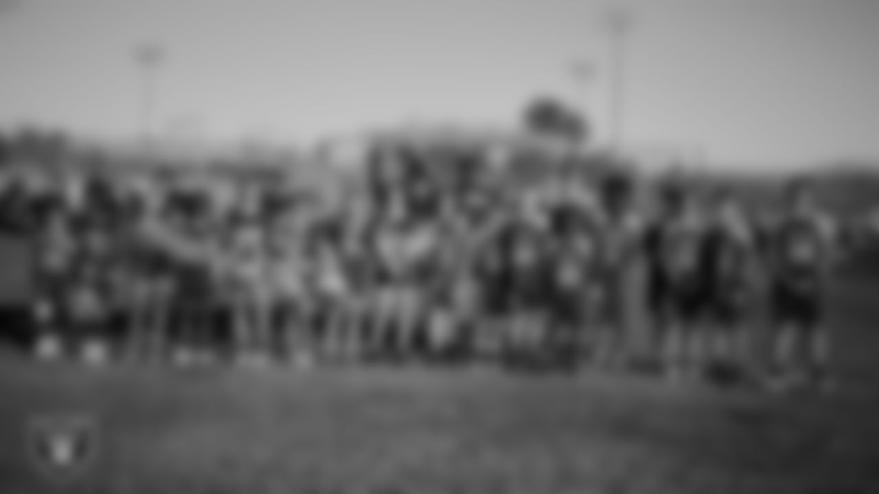 Ralph Cadwallader Middle School 8th graders pose for a photo before the Las Vegas Raiders' Middle School Flag Football Showcase game at Ralph Cadwallader Middle School.