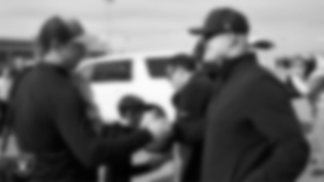 Las Vegas senior vice president of coaching operations Matt Capurro greets Head Coach Klint Kubiak as he and his family arrive in Henderson.