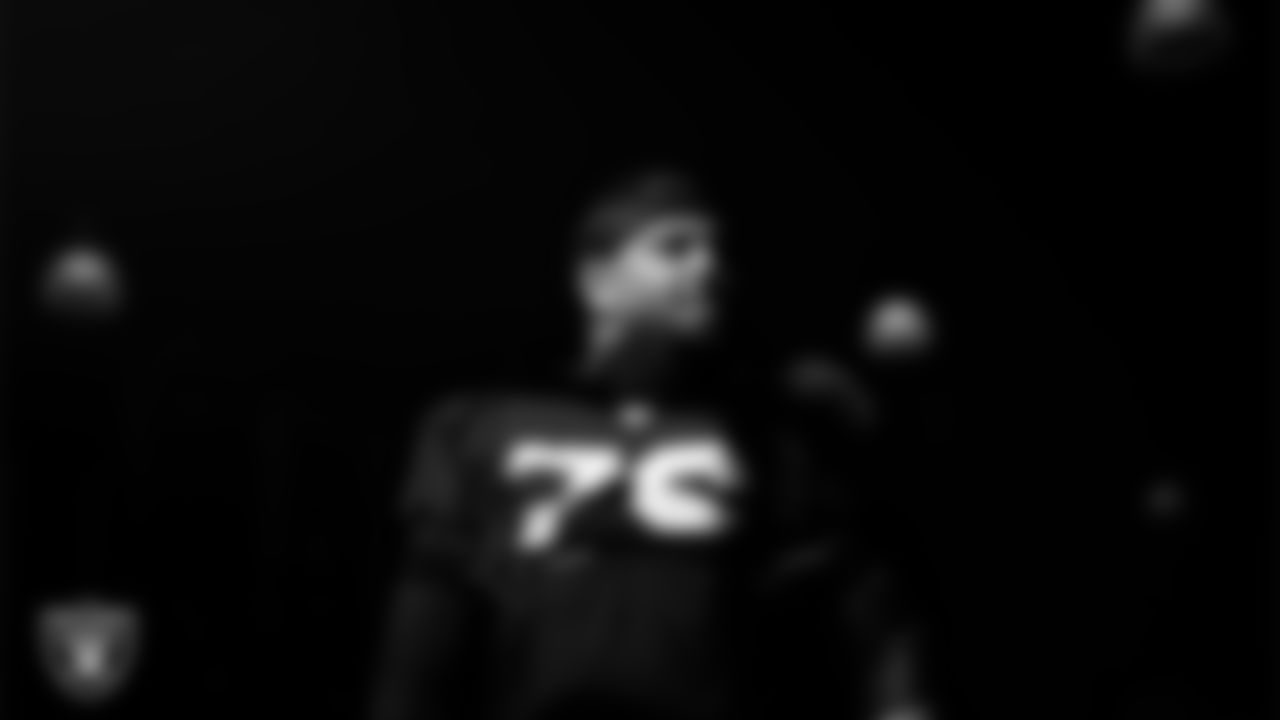 Las Vegas Raiders guard Caleb Rogers (76) walks out to the field for practice at Intermountain Health Performance Center.