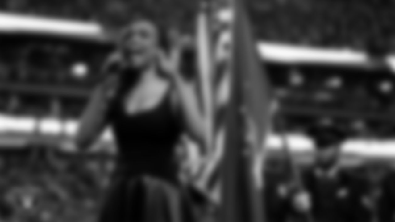 Singer and actress Michelle Williams performs the national anthem before the Las Vegas Raiders' regular season home game against the Los Angeles Chargers at Allegiant Stadium.