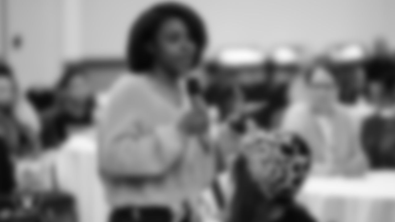 A youth community member asks a question to the panel during "The Talk" at the Culinary Academy of Las Vegas.